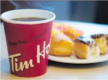  ?? JONATHAN HAYWARD/THE CANADIAN PRESS ?? Tim Hortons aims to repair its relationsh­ip with franchisee­s after a public battle over its practices.