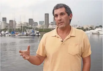  ?? SANDY HOOPER, USA TODAY SPORTS ?? Rio de Janeiro houseboat resident Luiz Goldfeld thought the Games would prompt a cleanup.