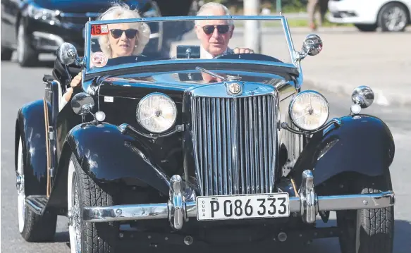  ?? Picture: GETTY ?? Prince Charles and Camilla take a drive through Havana in a classic MG.