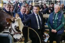  ?? AP PHOTO ?? n French President Emmanuel Macron attended the opening of the Paris Agricultur­al Fair on Saturday, Feb. 24, 2024, where he was also met by angry farmers who blamed him for not doing enough to support them.