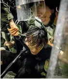  ?? GETTY IMAGES ?? A protester is tackled by police during clashes in Hong Kong.