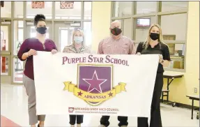  ?? LYNN KUTTER ENTERPRISE-LEADER ?? Jody Bergstron, left, and Andelyn Wright, right, both with the Arkansas Council for Military Interstate Children’s Compact Commission, stand with Shannon Cantrell, principal at Folsom Elementary, and Jon Purifoy, Farmington High principal. Both schools were named Purple Star Schools for their efforts in assisting children of military families.