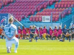  ?? GETTY ?? Players from North Carolina Courage and Portland Thorns FC kneel prior to Saturday’s NWSL game in Utah.