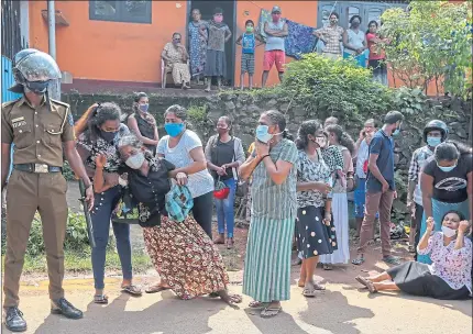  ??  ?? Sri Lankan families plead for the lives of relatives amid riots in Mahara Prison, Colombo, in November 2020. Eight inmates were killed and 40 injured when prison and police officials opened fire at rioters