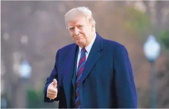  ?? CAROLYN KASTER/ASSOCIATED PRESS ?? President Donald Trump gives the thumbs-up on the South Lawn of the White House Friday as he returns from his physical exam at Walter Reed National Military Medical Center.