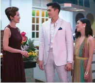  ?? Warner Bros. Pictures ?? ■ Pictured from left, Michelle Yeoh, Henry Golding and Constance Wu appear in a scene from "Crazy Rich Asians," in theaters on August 17.
