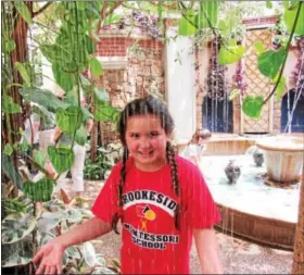  ?? SUBMITTED PHOTOS ?? A Brookeside student plays in the fountain in Longwood Gardens’ Indoor Children’s Garden.