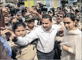  ?? Divyakant Solanki EPA/Shuttersto­ck ?? DEEPIKA PADUKONE, right, who plays the queen, has been a target of threats. One group threatened to cut off her nose; one person called for her beheading.