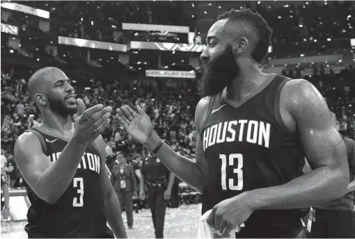  ?? The Associated Press ?? TOP SEED: Rockets guards Chris Paul (3) and James Harden celebrate the team’s 112-102 win in Game 5 of their second-round NBA playoff win over the Utah Jazz in Houston. The win eliminated Utah and allowed Houston to advance to face Golden State in the...