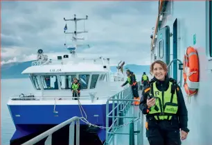  ?? ?? Above: Arnarlax workers and workboat, at one of the company’s sites in Iceland