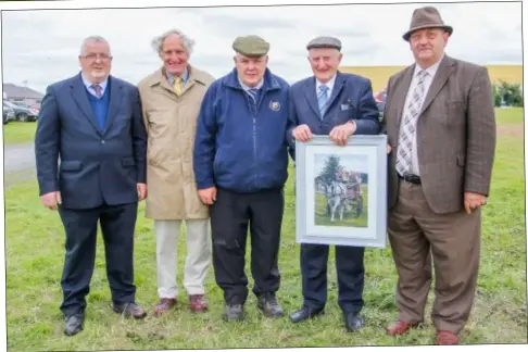  ??  ?? (above) To mark his official retirement from showing, wellknown Irish Draught enthusiast Ken Bryan was presented with a framed photograph of his late stallion Rosheen Yeats by show chairman Michael Murphy, IDHBA president David Cosby, Paddy McCarthy of...