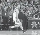  ?? AP ?? Wisconsin's Brad Davison is all fired up after hitting the winning three-point basket against Maryland in the final seconds on Jan. 14. Wisconsin upset Maryland, 56-54.