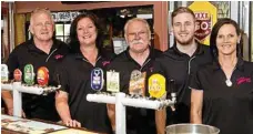  ??  ?? Geoff Murphy and Heather Murphy with their staff (from left) Wayne Wallace, Tom O'Gradey and Jodi Klingberg.