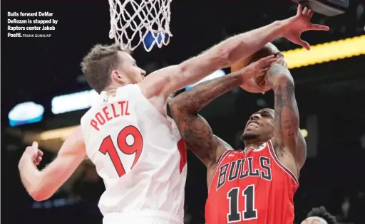  ?? FRANK GUNN/AP ?? Bulls forward DeMar DeRozan is stopped by Raptors center Jakob Poeltl.