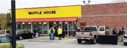  ??  ?? Police investigat­e the scene of a shooting in Antioch, Tennessee. — AFP photo