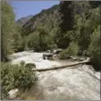  ?? AP photo ?? Melting snowpack is creating raging rivers that are running high, fast and icy cold. This June 10 photo shows the Big Cottonwood Creek, in the Big Cottonwood Canyon, near Salt Lake City.