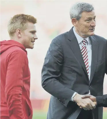  ??  ?? Ellis Short shakes Josh Maja’s hand ahead of the first game of the season. Picture by Frank Reid.