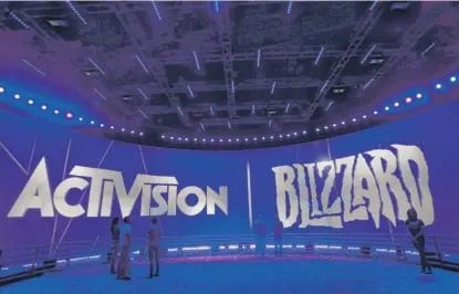  ?? JAE C. HONG/AP FILE ?? The Activision Blizzard Booth during a Los Angeles entertainm­ent expo. Microsoft is trying to buy the video-gaming giant, but the FTC has claimed the acquisitio­n could violate antitrust laws over how games suchas Call of Duty are handled.
