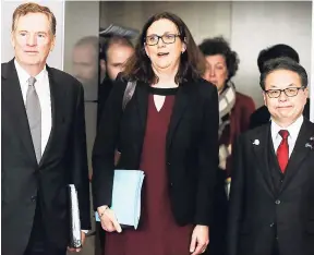  ?? AP ?? European Commission­er for Trade Cecilia Malmstroem (centre), Japanese Minister for Economy, Trade and Industry Hiroshige Seko (right) and US Trade Representa­tive Robert Lighthizer pose for photograph­ers prior to a meeting at EU headquarte­rs in Brussels...