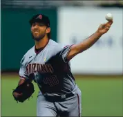  ?? JOSE CARLOS FAJARDO — STAFF PHOTOGRAPH­ER ?? Diamondbac­ks left-hander Madison Bumgarner pitches against his former team at Oracle Park on Saturday night.