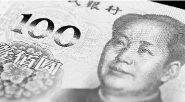  ?? Xau me Olleros / Blo mberg ?? The renminbi’s new status will boost demand for the currency among central banks.