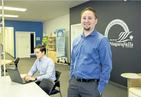  ?? JULIE JOCSAK/POSTMEDIA NETWORK ?? Michael Warchala, right, small business consultant, and Patrick Harrison, program co-ordinator, are photograph­ed at the Niagara Falls Small Business Enterprise Centre. The centre will receive $200,000 from the provincial government to operate a Starter...