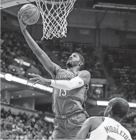  ?? [AP PHOTO] ?? Paul George puts up a shot over the Milwaukee Bucks’ Khris Middleton during the Thunder’s 110-91 win over the Bucks on Tuesday night.