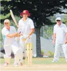  ?? Photo / Supplied ?? Livingston­e Building Rosetown Rogues’ Andrew Macpherson wicket-keeping and Bill Harris fielding in slips.