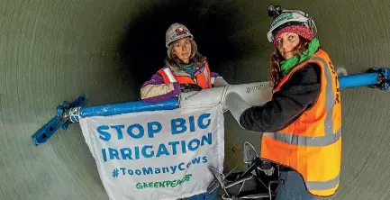  ?? PHOTO: STUFF ?? Greenpeace protesters inside one of the pipes at a Canterbury irrigation scheme constructi­on site.