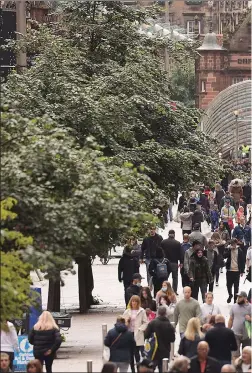  ??  ?? OUT AND ABOUT: Shoppers flocked back to Buchanan Street in Glasgow city centre, above, with many wearing face masks, right