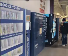  ?? KARENA WALTER THE ST. CATHARINES STANDARD ?? The St. Catharines Public Library’s Books to Go vending machine at Seymour Hannah arena has been serving the community for one year.