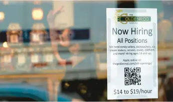  ?? ROBERT F. BUKATY/AP ?? A sign advertises for help at The Goldenrod, a popular restaurant and candy shop, on June 1 in York Beach, Maine.