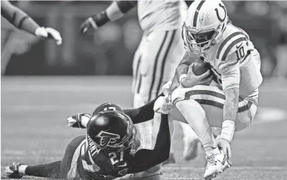  ?? ALEX SLITZ/AP ?? Colts quarterbac­k Gardner Minshew (10) is sacked by Falcons safety Richie Grant (27) during the second half on Sunday in Atlanta.