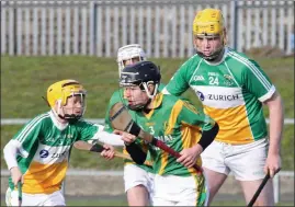  ??  ?? Brian Whitty of Rathgarogu­e-Cushinstow­n taking on James Lawless and Ciarán Doyle from Duffry Rovers (winners) in the 2019 Enniscorth­y Guardian Under-15 hurling Roinn 1 shield final.