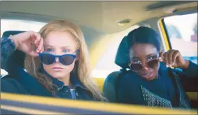  ?? AP ?? This image released by STX Films shows Kristen Bell, left, and Kirby Howell-Baptiste in a scene from “Queenpins.”