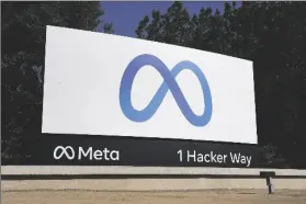  ?? PHOTO BY TONY AVELAR VIA AP ?? LEFT: Facebook’s Meta logo sign is seen at the company headquarte­rs in Menlo Park, Calif., in 2021. Meta said Thursday it is prepared to block access to news content for some Canadians on Facebook and Instagram as part of a temporary test that is expected to last through the end of June.