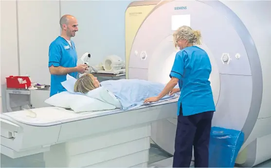  ?? Picture: Kris Miller. ?? Senior MRI radiograph­er James Muir carries out a procedure at Ninewells Hospital in Dundee.