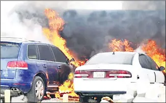  ?? Al Rai photo ?? Flames engulf two cars.