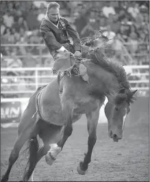  ?? NWA Democrat-Gazette/ANDY SHUPE ?? Logan Corbett of Las Cruces, N.M., competes in the bareback riding competitio­n.