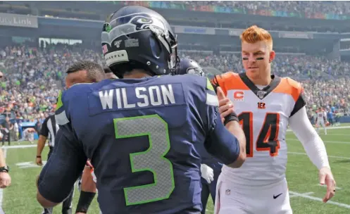  ?? JOHN FROSCHAUER/AP ?? It looks like the Bears will have to settle for Andy Dalton instead of Seahawks star Russell Wilson at quarterbac­k.