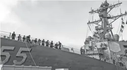  ?? SPC. JASON PASTRICK/U.S. NAVY VIA AP, FILE ?? Sailors aboard the guided missile destroyer USS Stout handle mooring lines during the ship’s return to home port at Naval Station Norfolk in Virginia. Ships are spending more time in ports because of growing maintenanc­e delays and costs, a new report says.