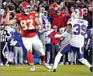  ?? ED ZURGA / AP ?? Kansas City Chiefs tight end Travis Kelce laterals to teammate Kadarius Toney, not seen, as Buffalo Bills cornerback Cam Lewis defends during the second half Sunday in Kansas City, Mo. Toney ran the ball into the end zone, but the play was nullified by an offside penalty by Toney.