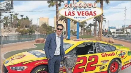  ?? IMAGES/BRIAN LAWDERMILK]
[NASCAR GETTY ?? New NASCAR champion Joey Logano did the customary photo op at the Vegas strip gateway during NASCAR Champion’s Week.