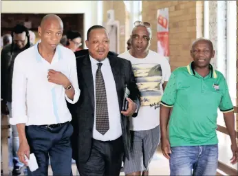  ?? PICTURE: DANIE VAN DER LITH ?? Former ANC chairman and former MEC for Finance, John Block, second left, walked out of the Northern Cape High Court yesterday with supporters by his side after he was sentenced to 15 years’ imprisonme­nt.