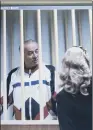  ??  ?? ‘PARDONED’: Spy Sergei Skripal appears behind bars during a court hearing in Moscow in 2006.