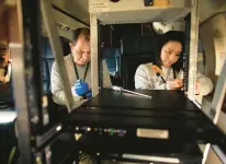  ?? ?? Instrument technician Sanxiong Xiong, left, and Mary Angelique Demetillo, a post-doctoral student, install an electrical panel on the Gulfstream III.