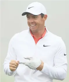  ??  ?? Rory McIlroy smiles on the practice range during a practice round prior to the 2018 US Open at Shinnecock Hills Golf Club in Southampto­n, New York. — AFP photo