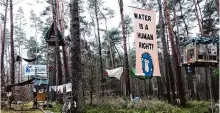  ?? Cevin Dettlaff/associated Press ?? Environmen­tal activists are staging a protest in a forest near Berlin against plans to expand Tesla’s first plant in Europe.