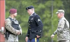  ?? Getty Images ?? U.S. Army Sgt. Robert Bowdrie “Bowe” Bergdahl, center, is escorted Monday to the military courthouse at Fort Bragg, N.C., following a recess after he pleaded guilty to desertion and misbehavio­r before the enemy.