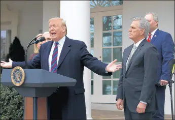  ?? JACQUELYN MARTIN/AP ?? President Donald Trump speaks Friday in the Rose Garden of the White House, alongside House Minority Leader Kevin McCarthy, R-Calif., and House Minority Whip Steve Scalise, R-La., after a meeting with congressio­nal leaders on border security.